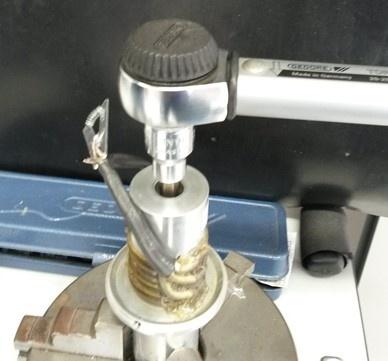 Ultrasonic welding converter bolt preloading with a click torque wrench.